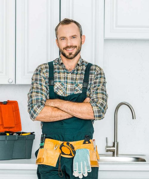 smiling-handsome-plumber-standing-with-crossed-arm-resize.jpg
